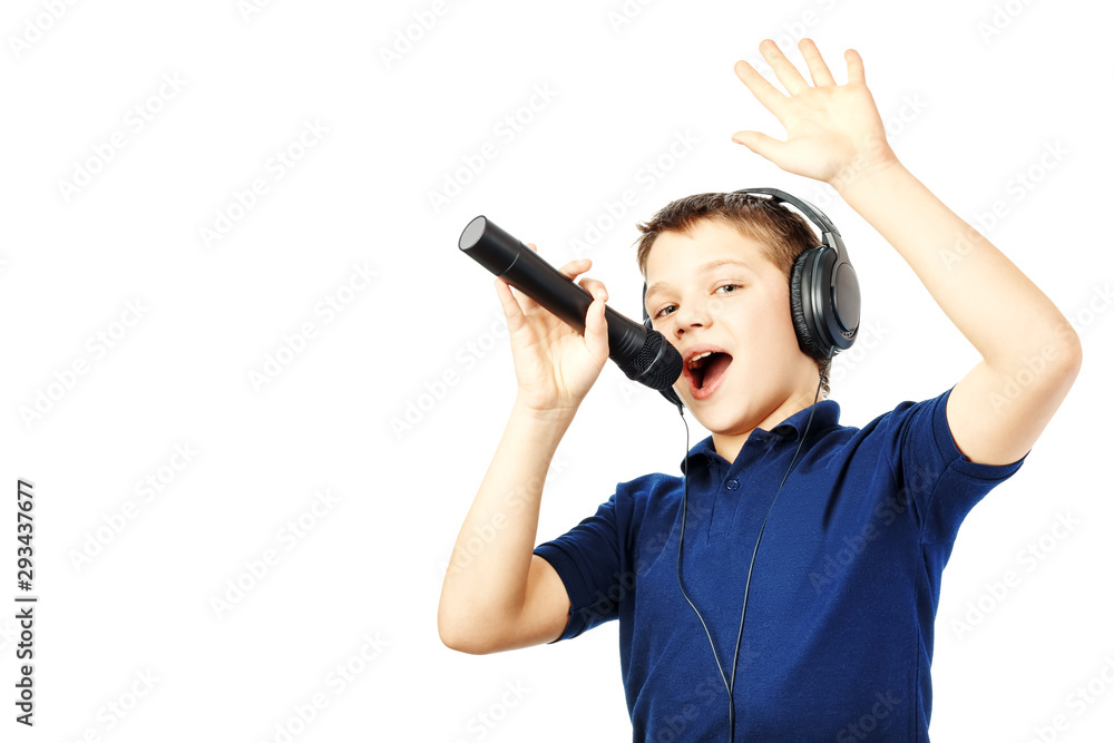 Teenage boy singing into a microphone and gesticulates with a hand. Very emotional. Teenage boy singing into a microphone and gesticulates with a hand. Very emotional.