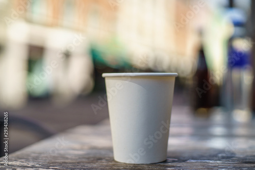 Coffee takeaway on the table - bokeh background