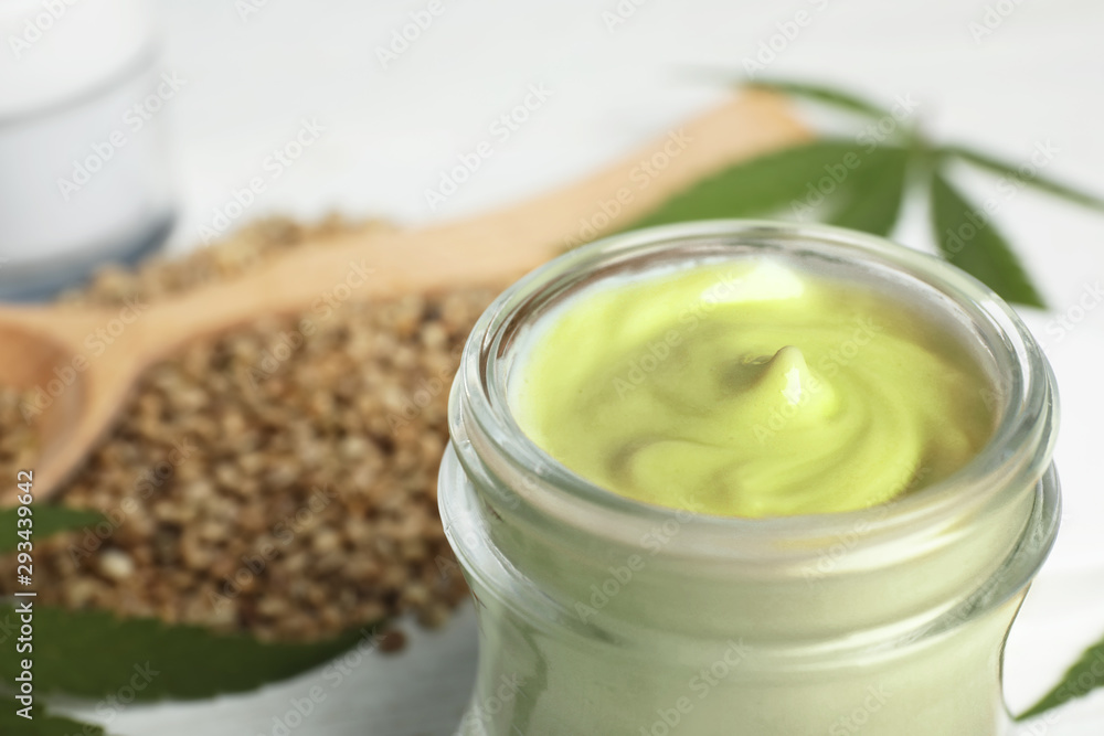 Jar of hemp cream on table, closeup. Organic cosmetics Jar of hemp cream on table, closeup. Organic cosmetics