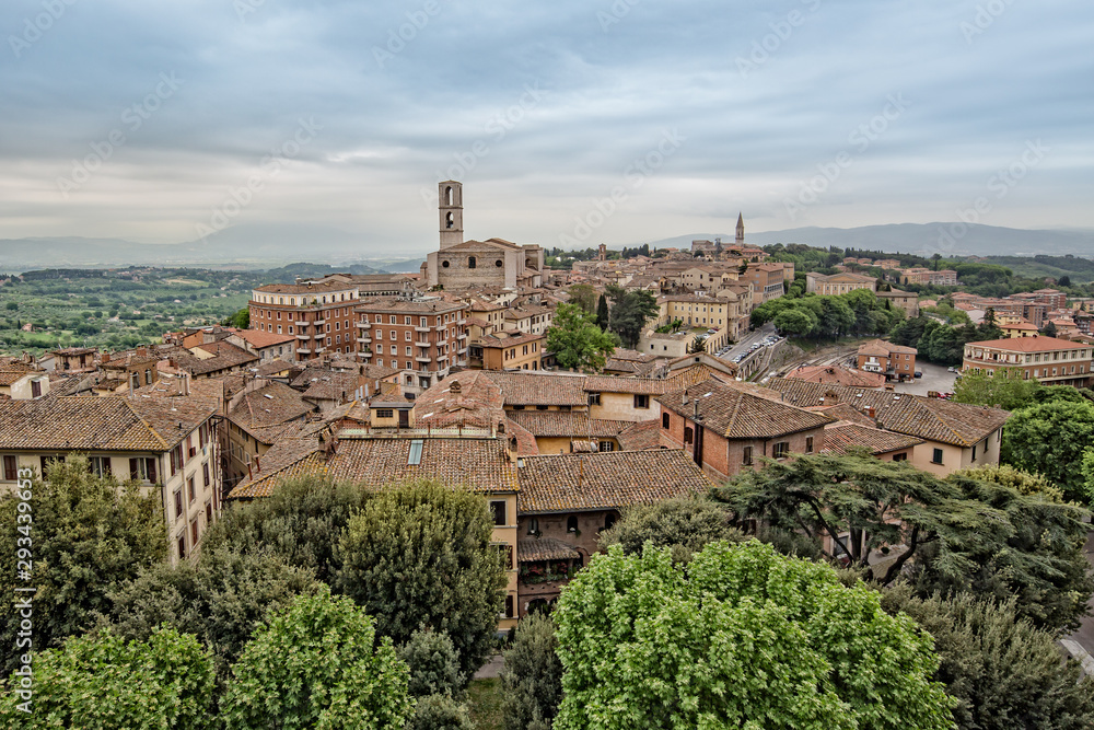 Perugia is a lively medieval walled hill town.View of the Basilica of San Domenico with medieval houses in Perugia historic quarter, Umbria, Italy