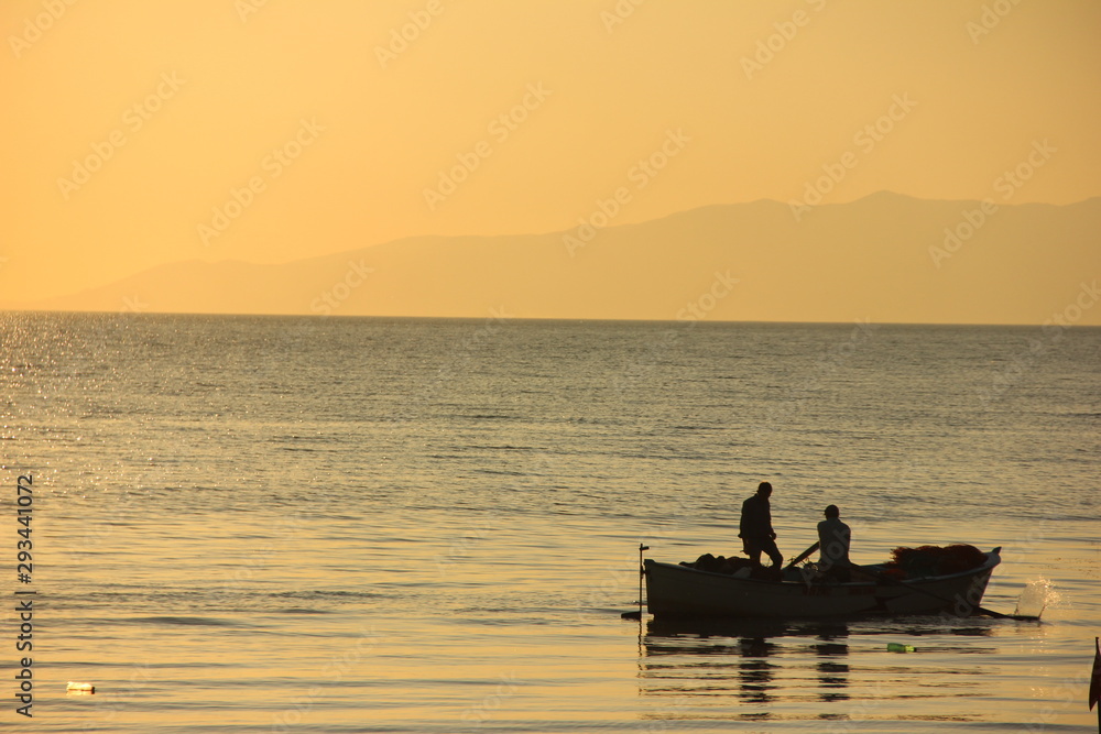 gün batımı ve balıkçılar