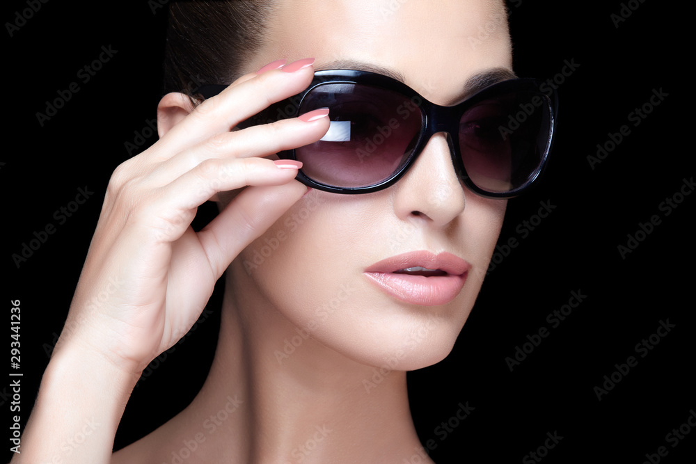 Fashion model girl with nude makeup and big sunglasses. Close up beauty face Fashion model girl with nude makeup and big sunglasses. Close up beauty face