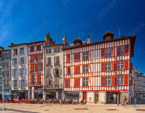Colorful houses at the Nive river embankment in Bayonne, France photo