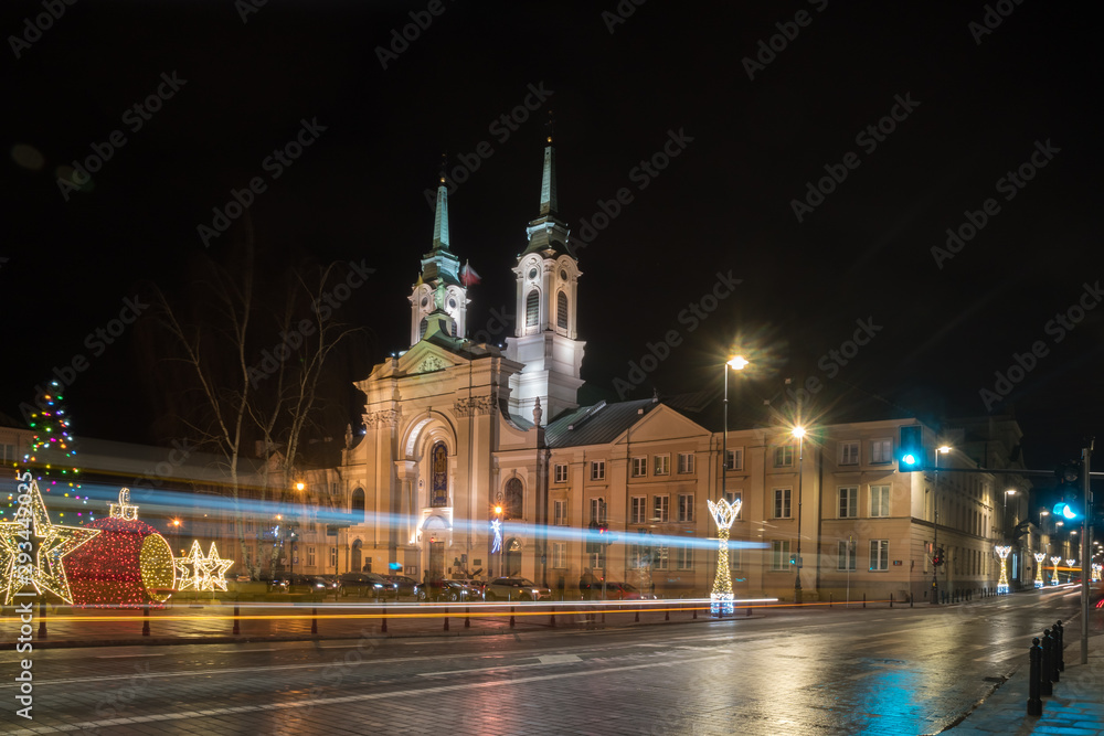 Fototapeta premium Front view of the baroque church at night. Warsaw, Poland.