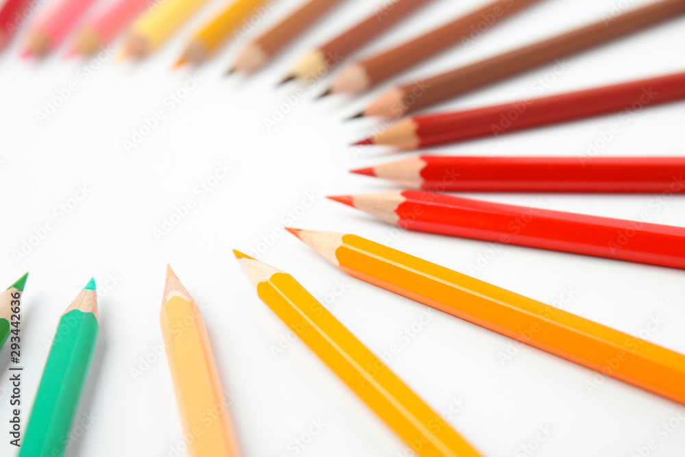 Composition with color pencils on white background Composition with color pencils on white background