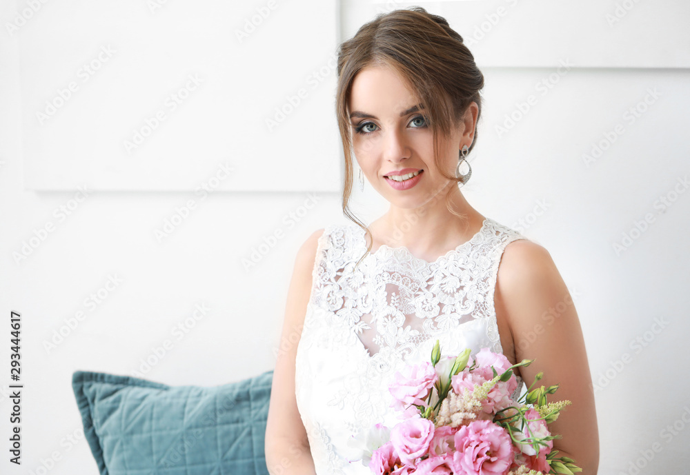 Beautiful young bride with bouquet before wedding ceremony at home Beautiful young bride with bouquet before wedding ceremony at home