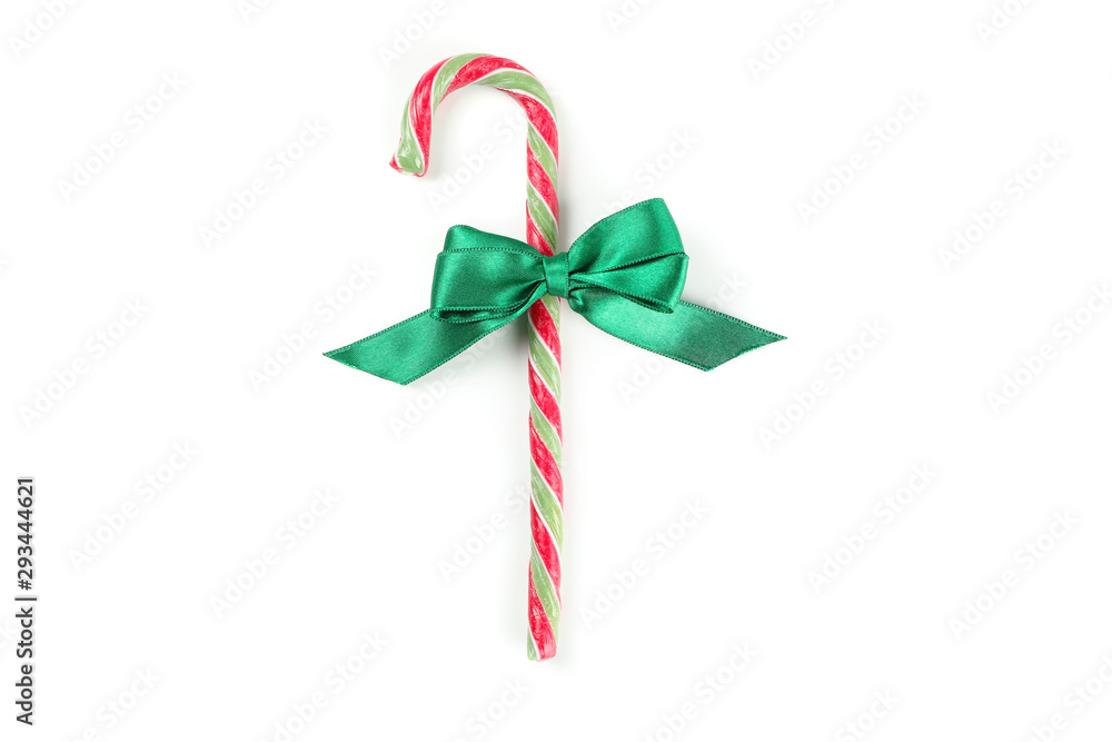 Sweet candy cane with bow isolated on white background Sweet candy cane with bow isolated on white background