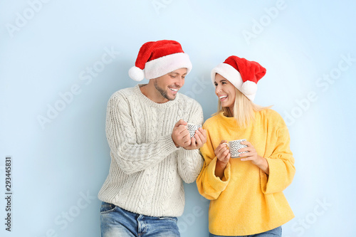 Happy couple in Santa hats ...