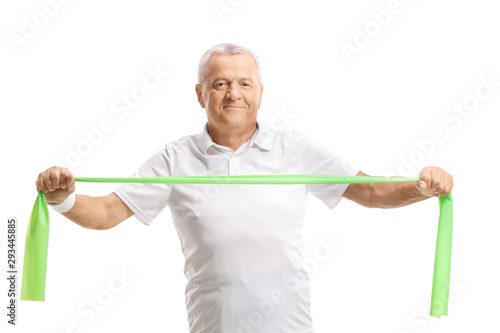 Elderly man exercising with a rubber band
