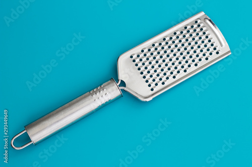 grater isolated on blue background