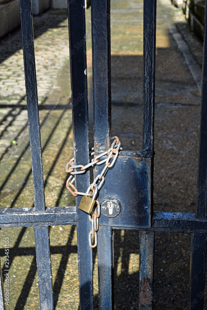 Padlocked metal gate with chain Padlocked metal gate with chain