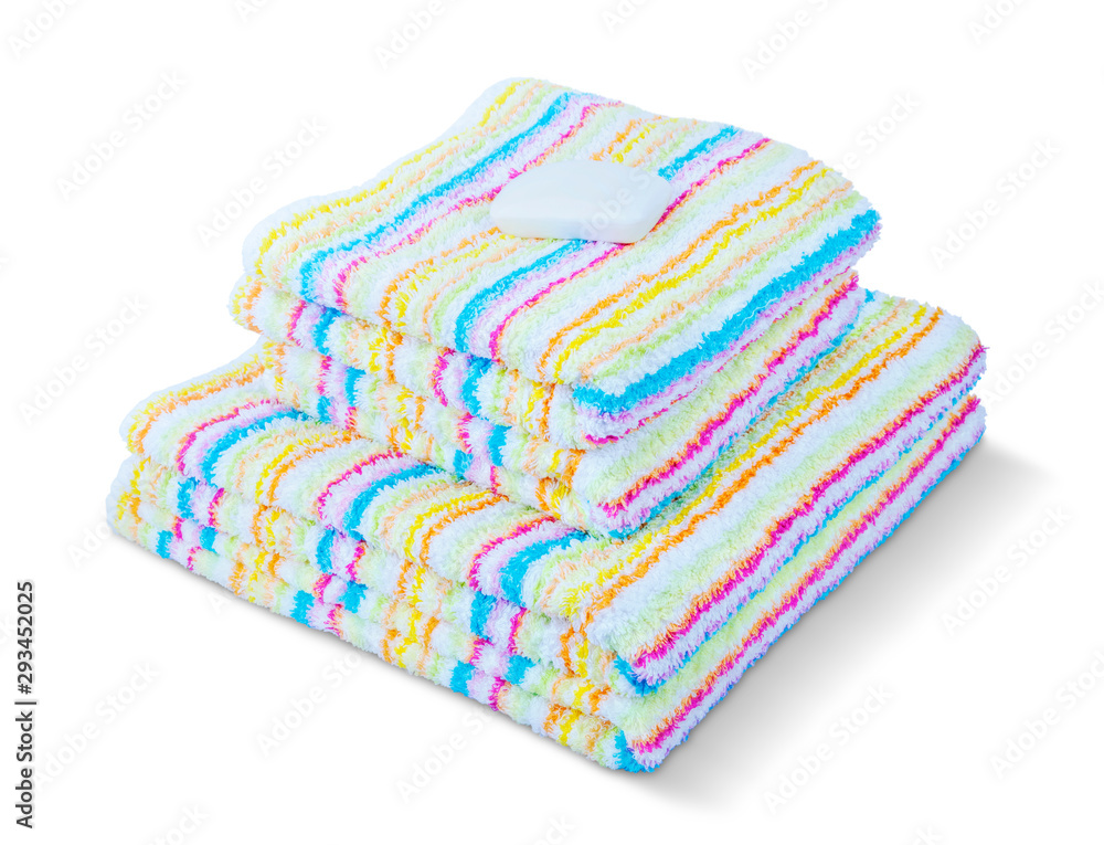 Stack of colorful towels with one soap isolated on a white background.