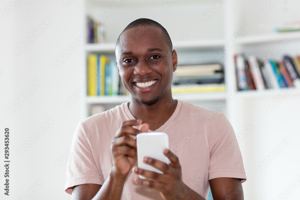 African american bald headed mature man sending sms African american bald headed mature man sending sms