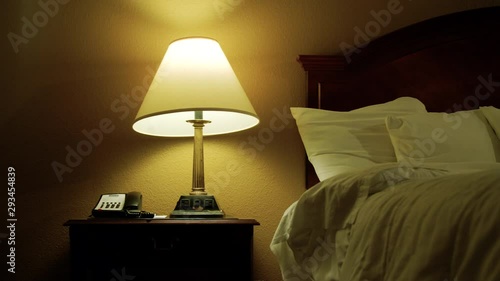 A haunted ghost lamp shade moves and rotates on its own in dim bedroom