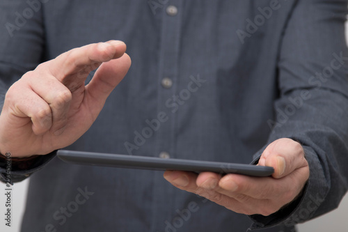 closeup of businessman hands with tablet or digital book © carballo