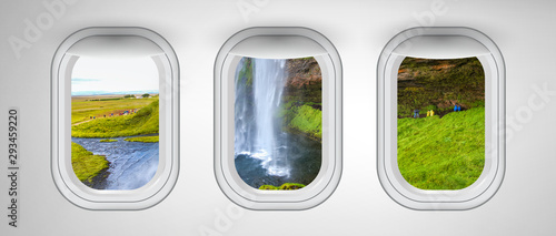 Airplane interior with window view of Seljaland Waterfalls, Iceland. Concept of travel and air transportation
