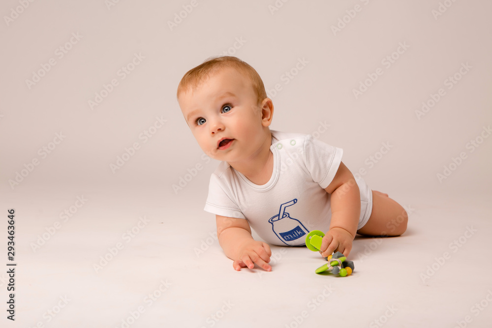 cute toddler boy on white background looking in frame, space for text, baby 8 months on white background cute toddler boy on white background looking in frame, space for text, baby 8 months on white background