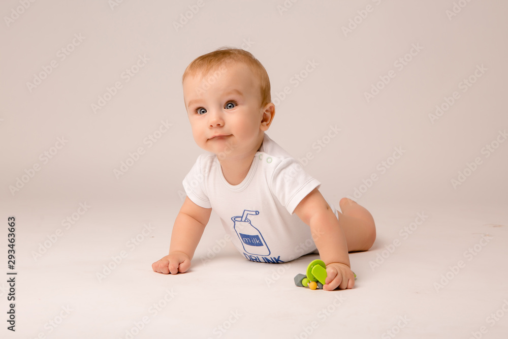 cute toddler boy on white background looking in frame, space for text, baby 8 months on white background cute toddler boy on white background looking in frame, space for text, baby 8 months on white background