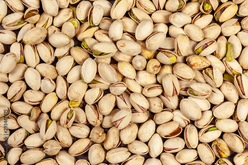 Background of laid flat pistachio nuts
