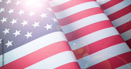 Fototapeta Naklejka Na Ścianę i Meble -  Flag of United States of America. Waving patriotic background with lens flare effect