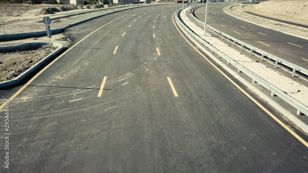 Road construction. Construction of a bypass road near the city. Transport. Construction site. Asphalt road for traffic. Background. Aerial view Road construction. Construction of a bypass road near the city. Transport. Construction site. Asphalt road for traffic. Background. Aerial view