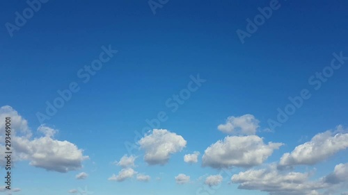 time lapse blue sky with clouds moving from left to right background