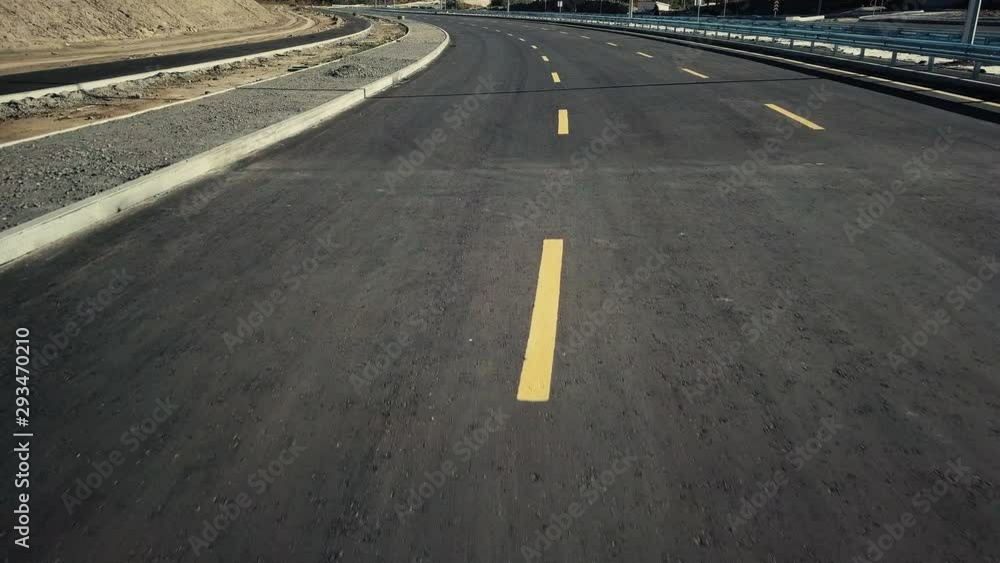 Road construction. Construction of a bypass road near the city. Transport. Construction site. Asphalt road for traffic. Background. Aerial view Road construction. Construction of a bypass road near the city. Transport. Construction site. Asphalt road for traffic. Background. Aerial view