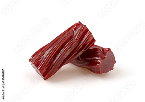 Two pieces of thick red licorice on a white background.