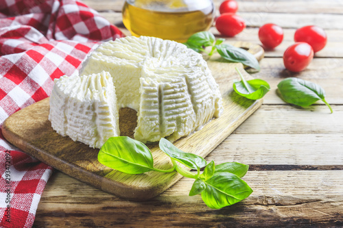 Fototapeta Naklejka Na Ścianę i Meble -  Fresh ricotta cheese with basil