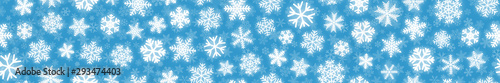 Christmas horizontal seamless banner of white snowflakes on light blue background