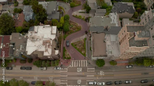 Aerial panoramic view of Lombard Street, an east–west street in San Francisco, CA. Famous for steep, one-block section with eight hairpin turns. Crookedest, steep hills, sharp curves, one-way road.