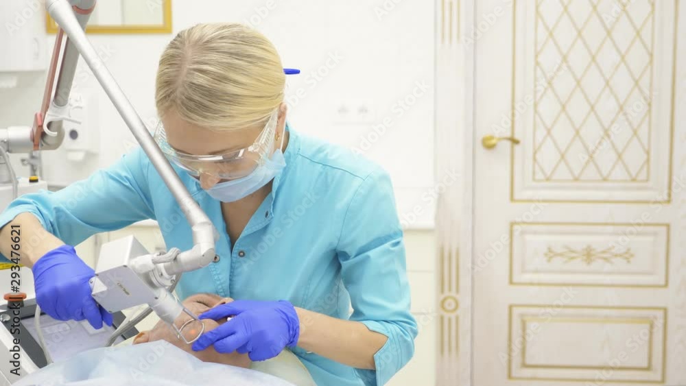 Doctor cosmetologist does the procedure of laser resurfacing of the face. skin rejuvenation concept, hardware cosmetology. Doctor cosmetologist does the procedure of laser resurfacing of the face. skin rejuvenation concept, hardware cosmetology.