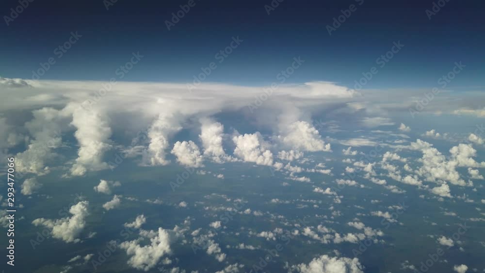 Aerial view of nice landscape, cloud and sky from airplane window looking down to land