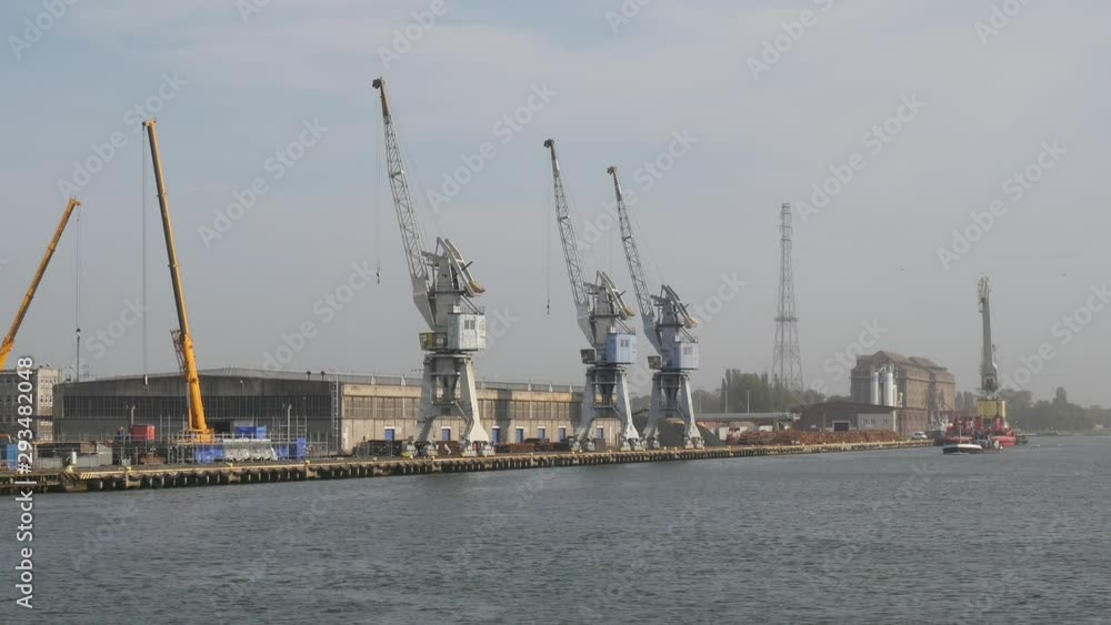 Sea Shipping Port with Cargo Cranes in Gdansk city at summer day Sea Shipping Port with Cargo Cranes in Gdansk city at summer day