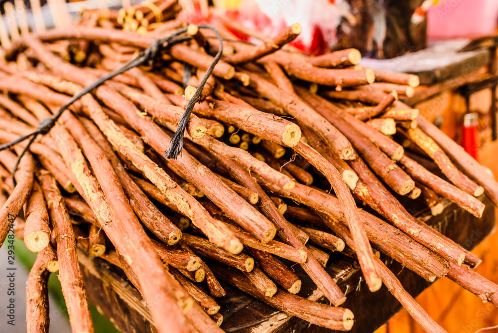 Stacks of dried licorice branches for sale. Stacks of dried licorice branches for sale.