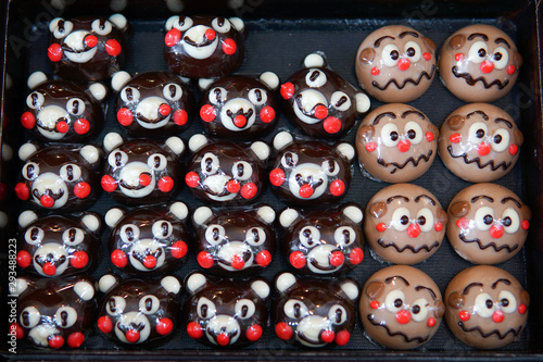 Chocolates in different shapes and sizes sold in open food market.