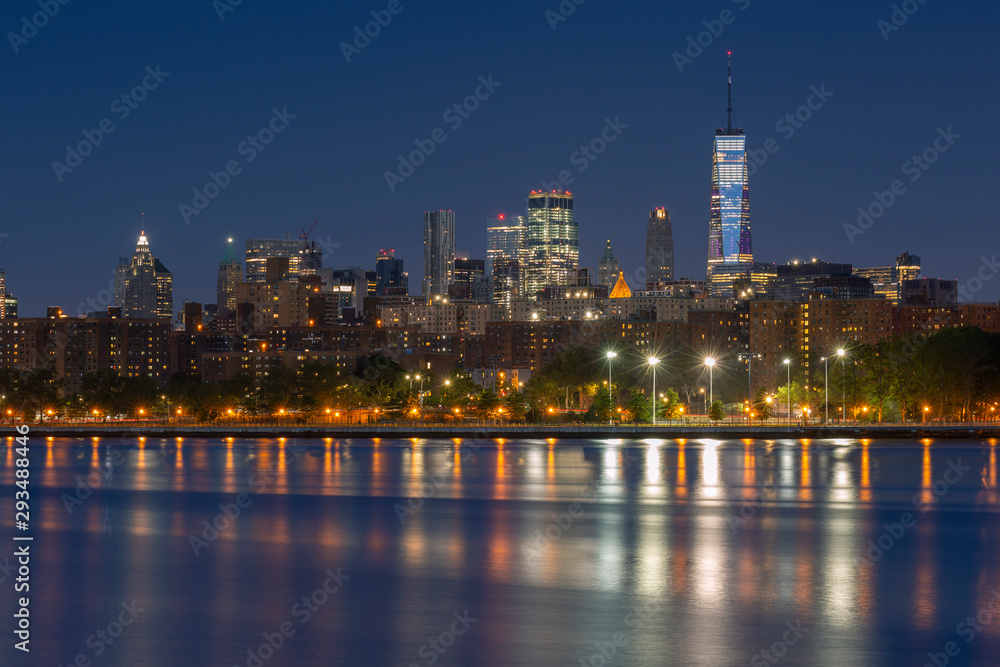 Downtown Manhattan view from  east river at sunrise with long exposure.