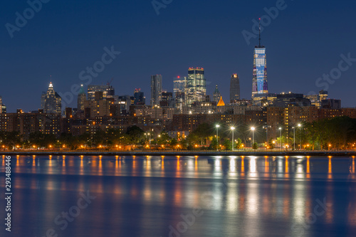 Downtown Manhattan view from  east river at sunrise with long exposure.