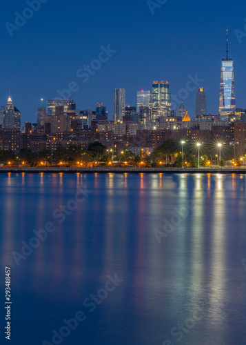 Downtown Manhattan view from East River at blue hour with long exposure
