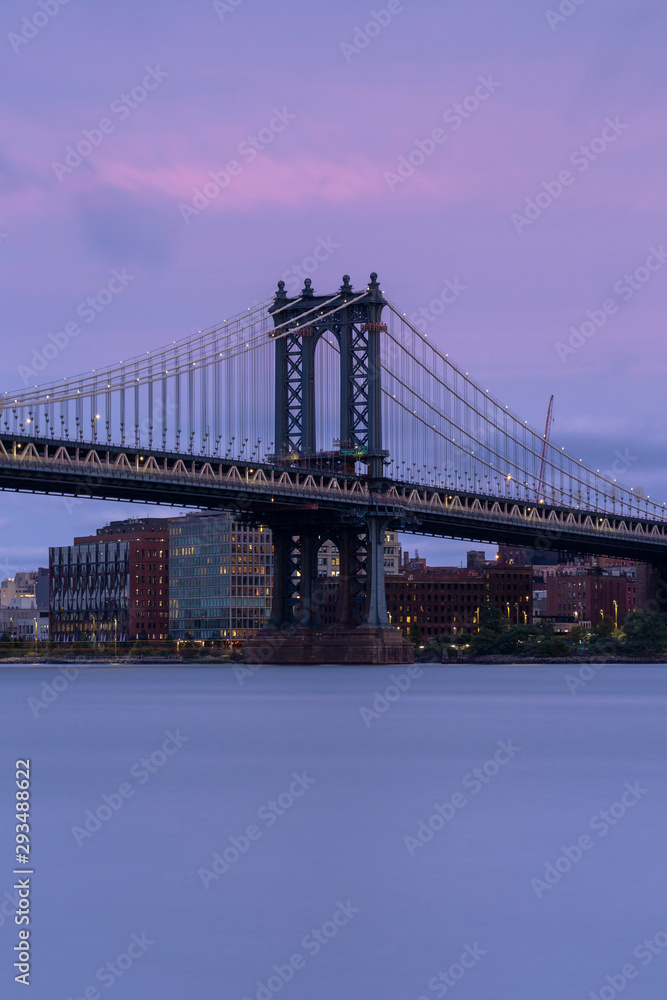Manhattan Bridge from East rivet at sunset with long exposure