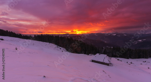Fantastic scenery of winter Ukrainian Carpathian mountains with tourists and tents