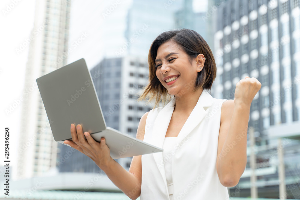Cheerful pretty working woman feeling happy in success Cheerful pretty working woman feeling happy in success