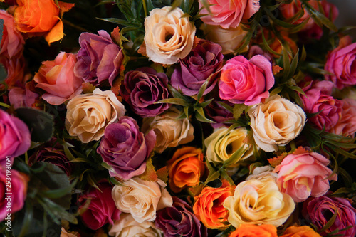 Fake flower and Floral background. rose flowers made of fabric. The fabric flowers bouquet. Colorful of decoration artificial flower