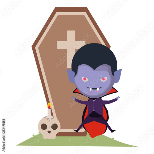 cute little boy with dracula costume and coffin