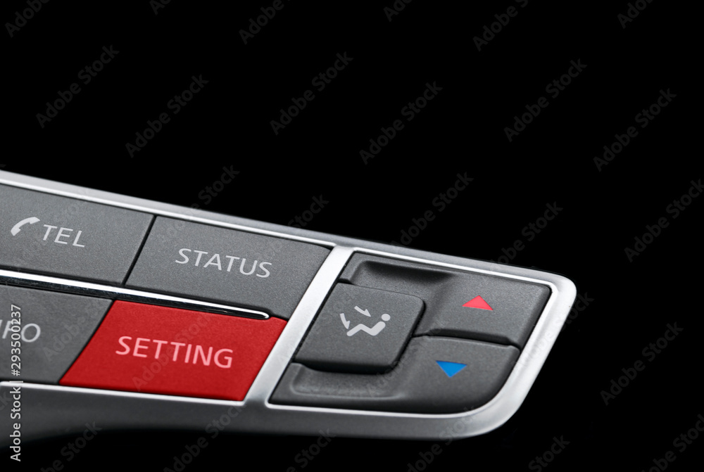 Obraz premium Luxury car inside. Interior of prestige modern car. Media control and climate buttons in black leather interior.