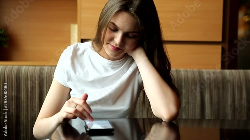 attractive young girl in a cafe