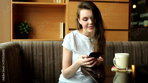 attractive young girl in a cafe
