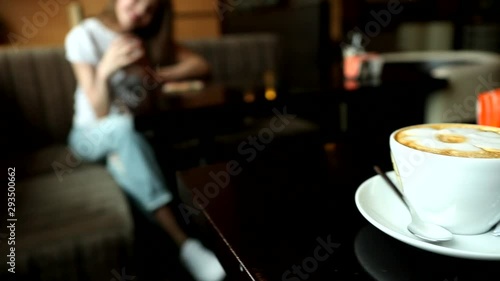 attractive young girl in a cafe