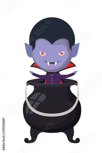 cute little boy with dracula costume and witch cauldron