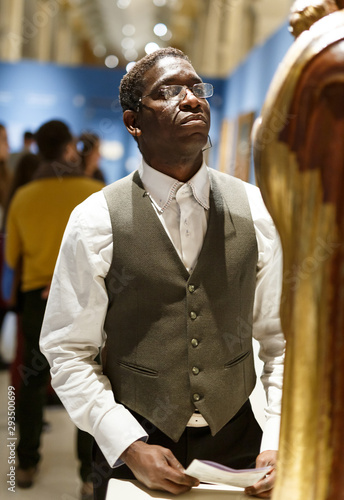 African man looking at exhibit